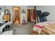 Bedroom showcasing a music studio, exercise equipment, and access to an ensuite bathroom at 10035 E Mexico Ave, Aurora, CO 80247