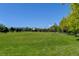 Expansive green space for outdoor activities and community enjoyment on a sunny day at 10035 E Mexico Ave, Aurora, CO 80247