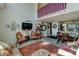 Open-concept living and dining area with modern décor and plenty of natural light at 10035 E Mexico Ave, Aurora, CO 80247