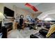 Spacious home office with a fireplace and built-in shelving at 10035 E Mexico Ave, Aurora, CO 80247