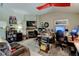 Bright home office featuring a fireplace, television, and custom shelving at 10035 E Mexico Ave, Aurora, CO 80247