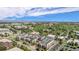Aerial view of community with lush greenery and mountain views in the distance at 301 Inverness S Way # 202, Englewood, CO 80112