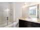 Bathroom with a shower and granite vanity with a sink at 301 Inverness S Way # 202, Englewood, CO 80112