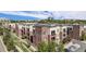 Modern building with balconies, lush landscaping, and convenient parking at 301 Inverness S Way # 202, Englewood, CO 80112