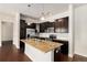 Kitchen with granite countertops, stainless steel appliances, and dark wood cabinetry, blending style and functionality at 301 Inverness S Way # 202, Englewood, CO 80112