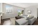 Bright living room with fireplace and balcony access, providing a comfortable and inviting space at 301 Inverness S Way # 202, Englewood, CO 80112