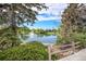 Picturesque community pond with a fountain, surrounded by lush greenery and trees at 301 Inverness S Way # 202, Englewood, CO 80112