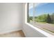 The window with the view of the street and foliage is perfect for people watching at 301 Inverness S Way # 202, Englewood, CO 80112