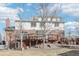Back of home showing brick and siding with large deck, and steps down to backyard at 767 Ellis St, Golden, CO 80401