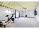 Spacious basement area with french doors, perfect for workouts with stationary bike and punching bag at 767 Ellis St, Golden, CO 80401