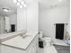 Well-lit bathroom with a large white countertop, sink, vanity, toilet, and a large mirror at 767 Ellis St, Golden, CO 80401
