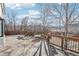 Home's spacious deck with railing and built-in benches overlooking the fenced yard at 767 Ellis St, Golden, CO 80401