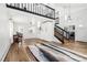 Open-concept living room with high ceilings, wood floors, and modern decor, with a view to the kitchen at 767 Ellis St, Golden, CO 80401