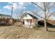 Charming backyard playhouse with a pink door, perfect for outdoor fun and recreation at 767 Ellis St, Golden, CO 80401