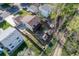 Aerial view of backyard landscaping with patios, green lawns, and small storage sheds at 17593 E Temple Dr, Aurora, CO 80015