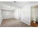 Finished basement area with carpet flooring and an adjacent bathroom at 17593 E Temple Dr, Aurora, CO 80015