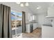 Bright kitchen featuring modern appliances, granite countertops and tile floor at 17593 E Temple Dr, Aurora, CO 80015