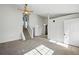 Spacious living area with high ceilings, staircase access, and abundant natural light at 17593 E Temple Dr, Aurora, CO 80015