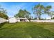 Large, green backyard featuring lush grass and a privacy fence at 5142 S Pennsylvania St, Littleton, CO 80121