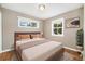 Comfortable bedroom with two windows for natural light and a warm, inviting atmosphere at 5142 S Pennsylvania St, Littleton, CO 80121