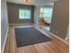 Open concept living space showcasing hardwood floors and abundant natural light, seamlessly connecting to other rooms at 5142 S Pennsylvania St, Littleton, CO 80121