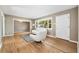 Bright living room featuring hardwood floors, modern white furniture, and natural light at 5142 S Pennsylvania St, Littleton, CO 80121