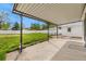 Covered patio leading to a spacious backyard with a white fence at 5142 S Pennsylvania St, Littleton, CO 80121