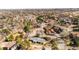 Expansive aerial view of neighborhood with mature trees and luxury homes against a Denver skyline backdrop at 14475 Foothill Rd, Golden, CO 80401