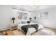 Bright bedroom with diamond windows, light wood floors, and modern lamps at 14475 Foothill Rd, Golden, CO 80401