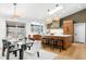 Modern kitchen featuring an island, stainless steel appliances, skylight, and dining area at 14475 Foothill Rd, Golden, CO 80401