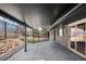 A covered patio with stone exterior, slider door, and rock landscape features at 14475 Foothill Rd, Golden, CO 80401