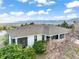 Aerial view of home showing the roof, surrounding landscaping, and mountainous views at 1285 Spinnaker Trl, Monument, CO 80132