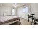 Bedroom with neutral colors, a musical drum set, hardwood floors, and natural light at 1285 Spinnaker Trl, Monument, CO 80132