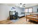 Comfortable bedroom with study desk, twin beds, and a ceiling fan to keep cool at 1285 Spinnaker Trl, Monument, CO 80132