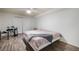 Bedroom with a neutral color scheme, hardwood floors, and a musical drum set at 1285 Spinnaker Trl, Monument, CO 80132