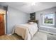 Bedroom featuring a chalkboard wall, wooden accents, and window at 1285 Spinnaker Trl, Monument, CO 80132