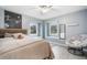 Bright bedroom with built-in window seats and a comfortable papasan chair at 1285 Spinnaker Trl, Monument, CO 80132