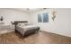 Bedroom with a neutral color scheme, bed, desk, and views of the outdoors at 1285 Spinnaker Trl, Monument, CO 80132