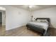 Minimalist bedroom featuring a bed, desk, and a window for plenty of natural light at 1285 Spinnaker Trl, Monument, CO 80132