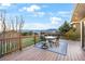 Outdoor deck features mountain and treetop views, with a dining table and chairs at 1285 Spinnaker Trl, Monument, CO 80132
