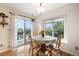 Cozy dining area with a sliding door to a deck with scenic outdoor views at 1285 Spinnaker Trl, Monument, CO 80132