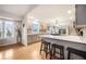 Modern kitchen boasting gray cabinetry, white countertops, stainless steel appliances, and sleek breakfast bar at 1285 Spinnaker Trl, Monument, CO 80132