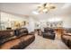Open concept living room flowing into the kitchen and dining areas at 1285 Spinnaker Trl, Monument, CO 80132