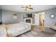 A cozy main bedroom featuring wood flooring, a fireplace, and a connecting bathroom at 1285 Spinnaker Trl, Monument, CO 80132