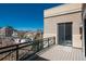 Balcony with city views, metal railings, and sliding door to the interior at 180 N Cook St # 509, Denver, CO 80206