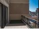 Relaxing balcony with views of the city and a touch of greenery at 180 N Cook St # 509, Denver, CO 80206