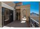 Private balcony with wood-style decking and a covered area for relaxing outdoors at 180 N Cook St # 509, Denver, CO 80206
