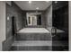Serene bathroom featuring a built-in soaking tub with dark tile and modern fixtures at 180 N Cook St # 509, Denver, CO 80206
