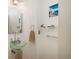 Elegant bathroom with a modern vessel sink, unique mirror, and spa-like ambiance at 180 N Cook St # 509, Denver, CO 80206