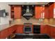 Well-equipped kitchen with granite countertops, gas range, and ample cabinet space for storage at 180 N Cook St # 509, Denver, CO 80206
